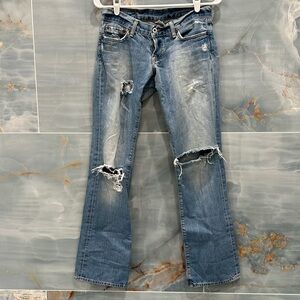 Lucky Brand low rise jeans very distessed